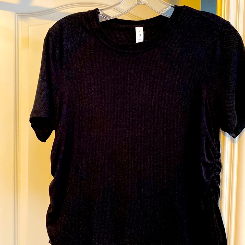 Lululemon black top with side ties size 8. Never worn